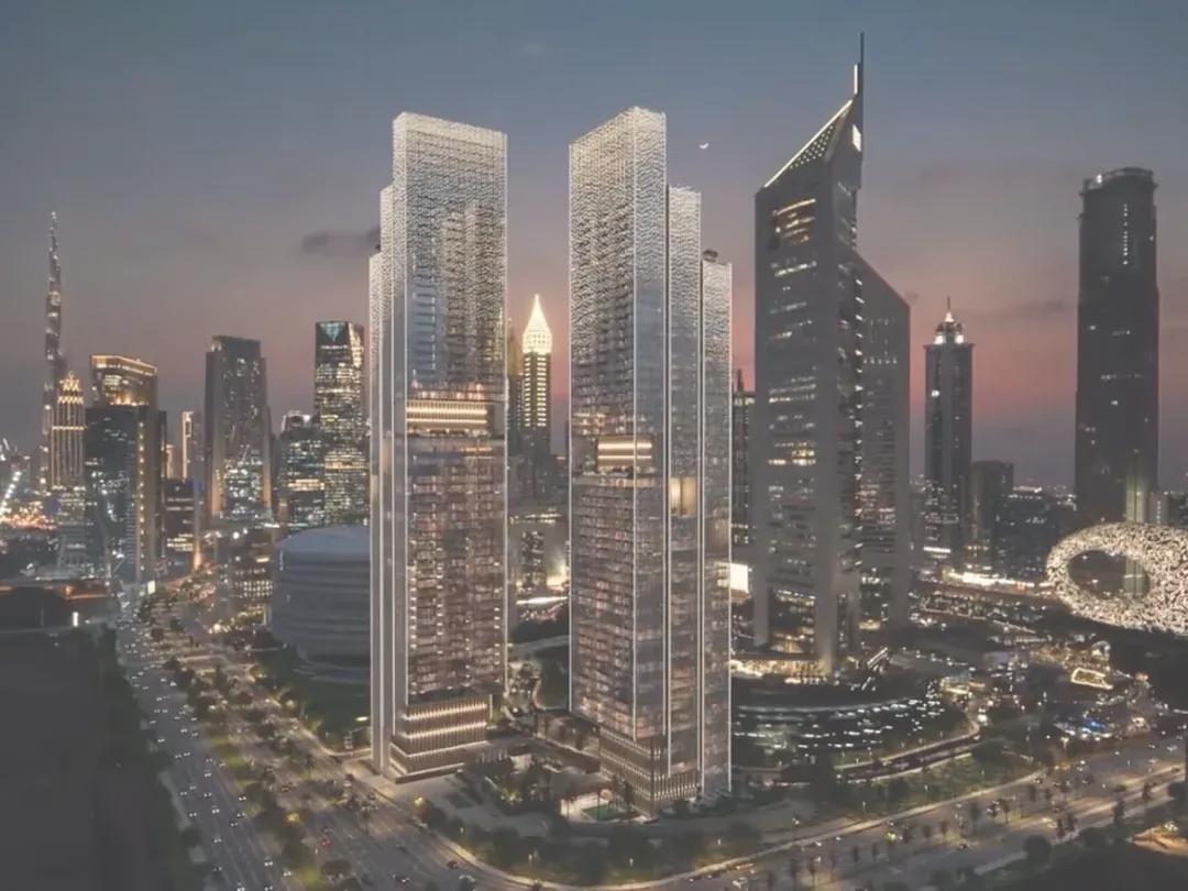 Jumeirah Residences Emirates Towers on the Sheikh Zayed Road skyline at night